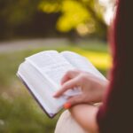 people, girl, sitting, reading, book, bible, hand, outdoor, brown book, brown books, brown reading, brown bible, bible, bible, bible, bible, bible
